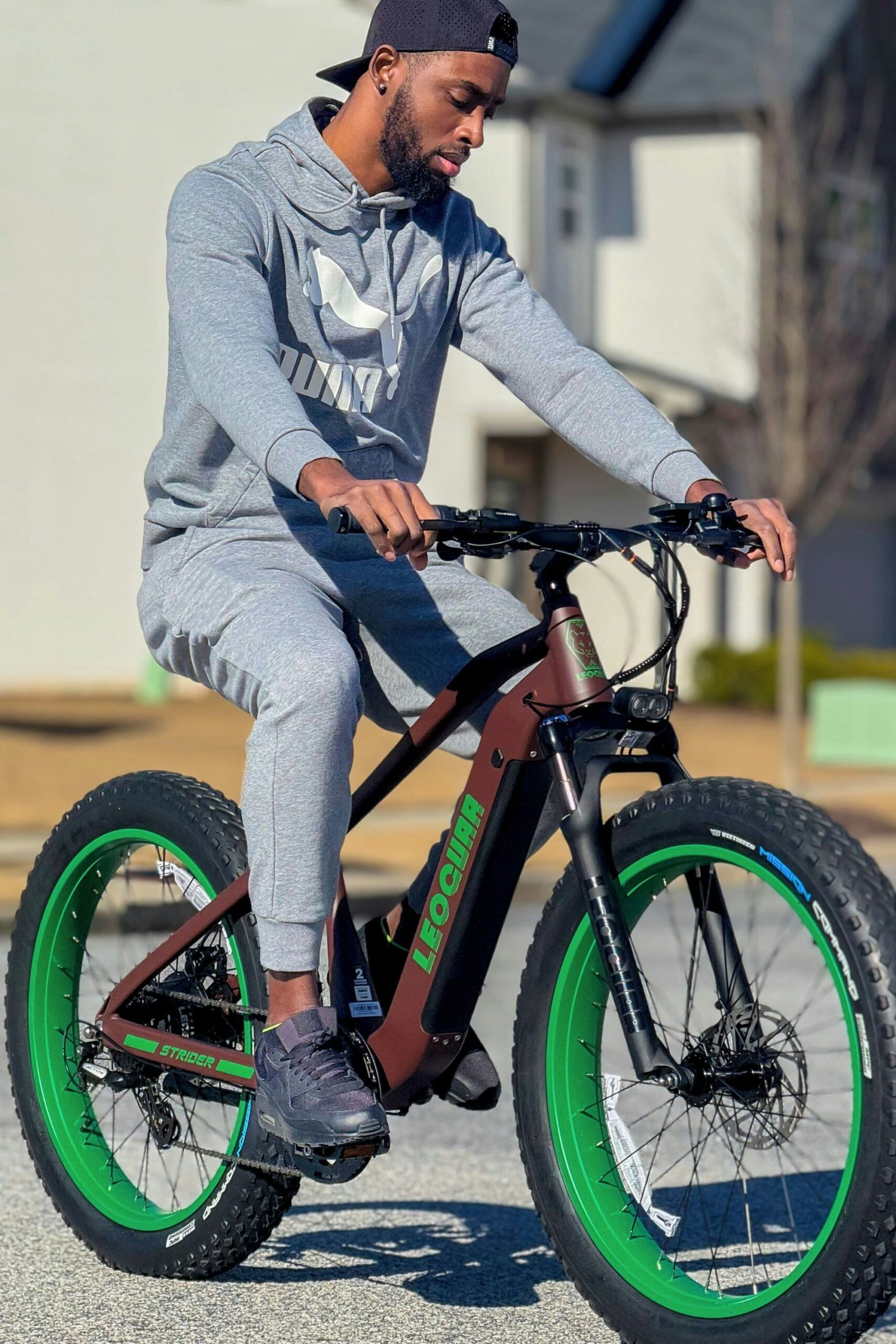 A man riding a bike on a street